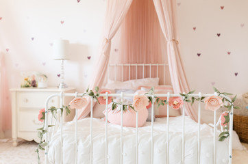 Toddler Girl room with felt flowers and canopy