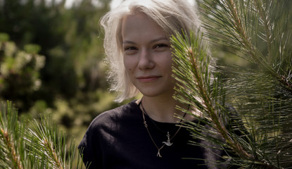 portrait of a girl with white hair in the woods