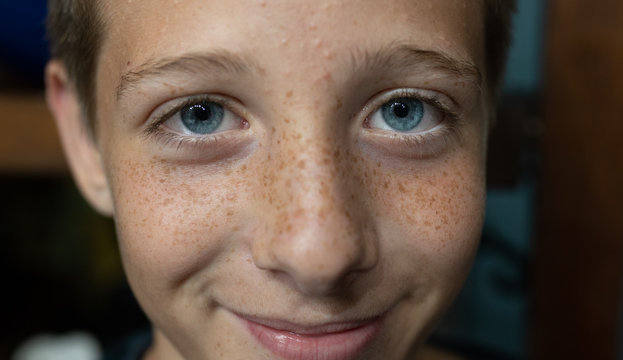little blue-eyed boy smiling