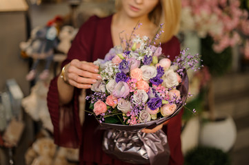 Close-up of bouquet in blond woman's hands