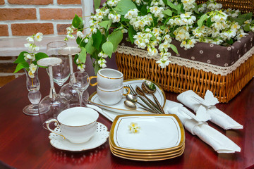 tableware and jasmine flowers. close-up