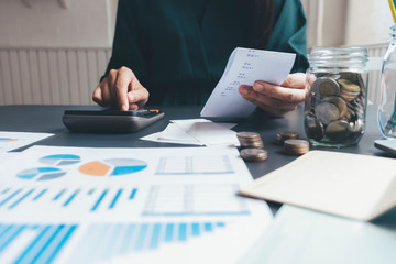 Accountant or banker calculate the cash bill.