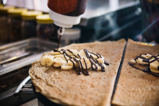 Fresh crepe with bananas and chocolate