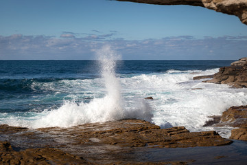 waves crashing on rocks