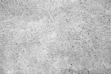 Texture of a concrete wall with cracks and scratches which can be used as a background