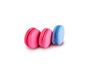Pink and blue macaroons isolated on a white background. Tasty french cookies