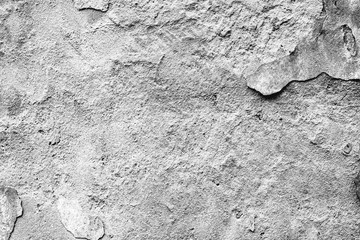 Texture of a concrete wall with cracks and scratches which can be used as a background