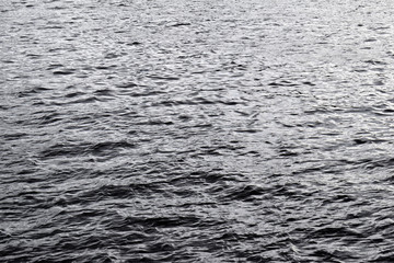 Small Waves on Grey River Waters