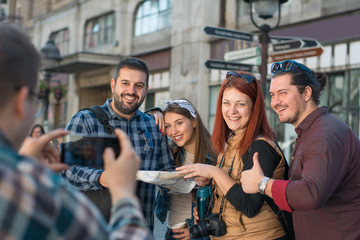 Group of tourists sightseeing the city