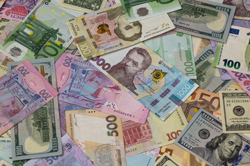 Closeup of dollar, euro and hryvnia banknotes 
