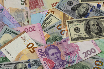 Fototapeta na wymiar Closeup of dollar, euro and hryvnia banknotes 