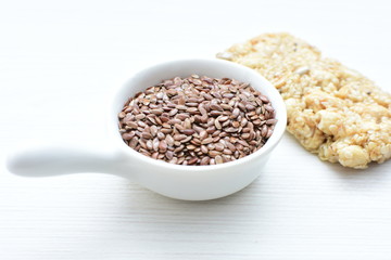  Natural sesame seeds on wooden background
