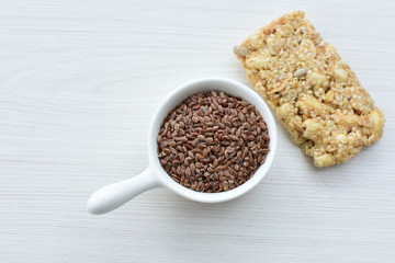  Natural sesame seeds on wooden background