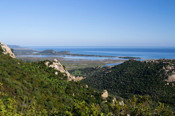 Fototapeta na wymiar Panorama degli stagni Feraxi e Colostrai dal Monte Liuru