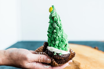 Christmas tree decorated chocolate cupcake