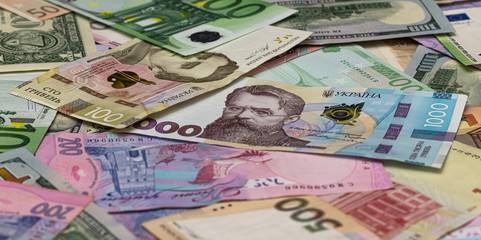 Obraz na płótnie Canvas Closeup of dollar, euro and hryvnia banknotes 