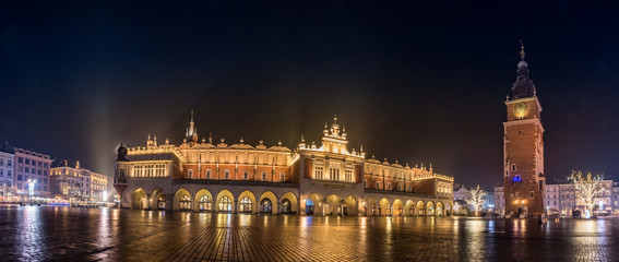 Fototapeta na wymiar Krakow, Poland, panorama of Main Square with Cloth Hall, St Mary's church and Town Hall tower in the night