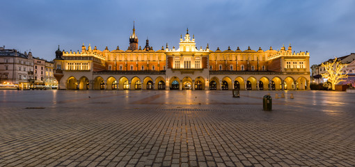 Krakow, Poland, illuminated cloth hall on the main square in the morning
