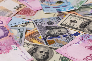 Closeup of dollar, euro and hryvnia banknotes 
