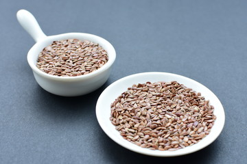  Natural sesame seeds on wooden background