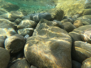  underwater background deep blue sea and beautiful light rays with rocky floor
