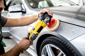 Fototapeta premium Car polishing details in workshop