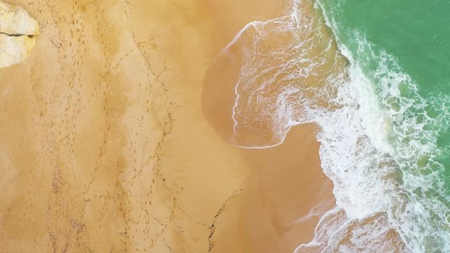 Rotation To Coastline Cliff At  Gruta de Benagil. High Angle Aerial View. Algarve, Portugal