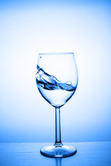 Glass with water up and splash