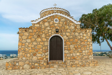 Fototapeta na wymiar The Church of the Prophet Elijah is located on the top of a mountain in Protaras.
