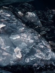 New ice in blue sea water. Ice cover.