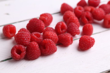delicious raspberries in colorful background