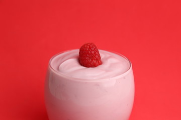 delicious raspberry yogurt in color background