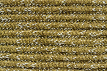 Knitted structure of green and gray threads. Horizontal lines
