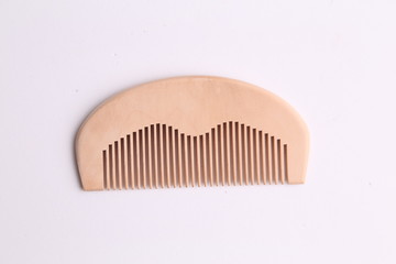 wooden comb in color background