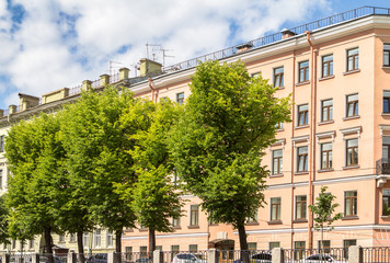 Fototapeta na wymiar Buildings on waterfront of St. Petersburg summer day, Russia