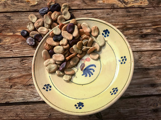 Dried broad beans in a traditional ceramic plate from Puglia