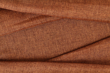 Brown fabric textile with copy space. Abstract Texture. Close up.
