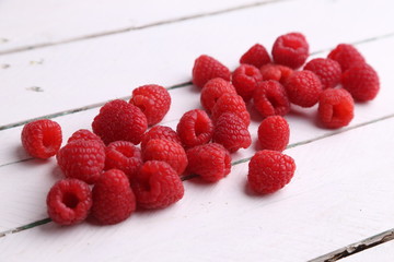 delicious raspberries in colorful background