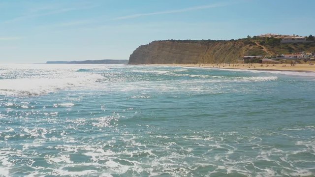 Fast speed Flight Over Atlantic Ocean Waves at Do Camilo beach, Lagos, Algerve, Portugal