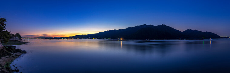 Fototapeta na wymiar Sunrise over sacred Miyajima island, Itsukushima, Hiroshima, Japan