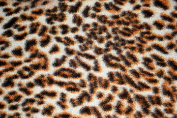 Fabric coloring leopard small and large black spots.