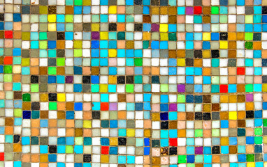 Wall with colorful mosaics  background. Multicolor squares look like pixels. background