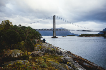 Classic Norwegian cold panoramic landscape of Efjorden fjord, Ballangen municipality, Nordland county, Ofoten district, Norway with Efjord Bridges, Stortinden mountain, Northern Norway