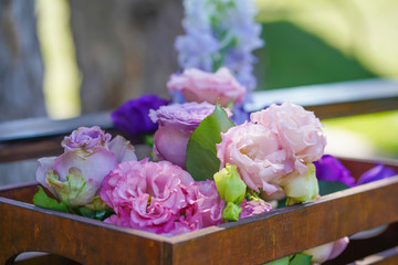 Bouquets of fresh flowers decoration of the festive table. Celebrating an open air party. Decor Details