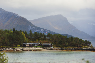 Naklejka premium Classic Norwegian cold panoramic landscape of Efjorden fjord, Ballangen municipality, Nordland county, Ofoten district, Norway with Efjord Bridges, Stortinden mountain, Northern Norway