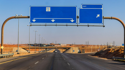 Traveling by car on desert roads