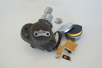 vintage 16mm movie camera on white background