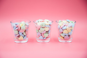 Heart shape message letter candy on pink background. Valentines day concept. 