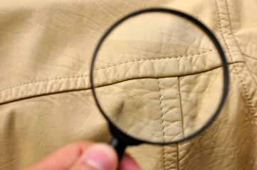Checking quality of leather cloth sewing texture