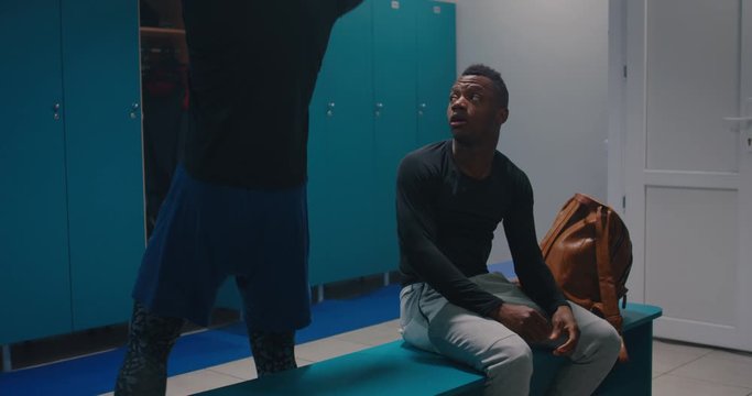 Men having conversation in locker room